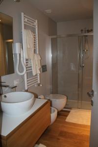 a bathroom with a shower and a sink and a tub at Villa Fornari Resort in Bisceglie +31 photos