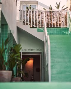a stairway leading to a house with a balcony at Mikasa Ibiza Boutique Hotel ADULTS ONLY in Ibiza Town