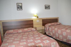 Postel nebo postele na pokoji v ubytování LABELLA - Hostal Rural Restaurante