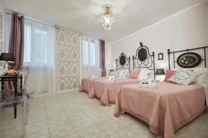 A bed or beds in a room at Il Piccolo Principe Affittacamere