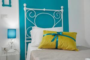 A bed or beds in a room at Il Piccolo Principe Affittacamere