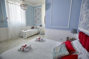 A bed or beds in a room at Il Piccolo Principe Affittacamere