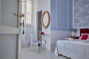 A bed or beds in a room at Il Piccolo Principe Affittacamere