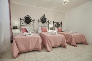 A bed or beds in a room at Il Piccolo Principe Affittacamere