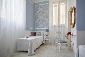 A bed or beds in a room at Il Piccolo Principe Affittacamere