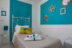 A bed or beds in a room at Il Piccolo Principe Affittacamere