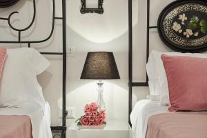 A bed or beds in a room at Il Piccolo Principe Affittacamere