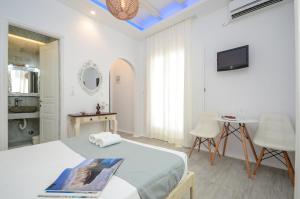 Valena Mare Suites & Apartments客房内的一张或多张床位