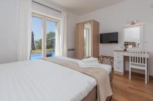 Postel nebo postele na pokoji v ubytování Villa Laura An + 37 fotografií