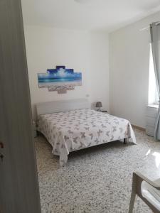 Ένα ή περισσότερα κρεβάτια σε δωμάτιο στο San Benedetto