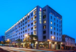 a large building on a city street at night at Lakeshore Hotel Hualien in Hualien City +57 photos