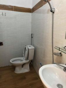 a bathroom with a toilet and a sink at Khuổi Ky Eco Homestay in Cao Bằng +140 photos
