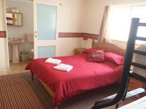 A bed or beds in a room at Chester Lodge 