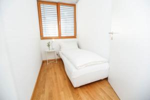 Postel nebo postele na pokoji v ubytování Gartenwohnung in prämierter Wohnanlage