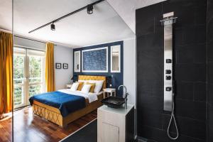 a bedroom with a king sized bed and a shower at Villa Orla in Gdynia