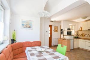 a living room with a couch and a table at Solmar, Apartment with big terrace near nature in Portorož