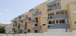 an apartment building with balconies on the side of it at Airem 22 in Roquetas de Mar