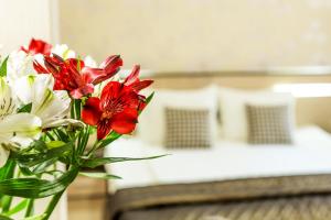 A bed or beds in a room at City Avenue Hotel by HMG-Free Parking-Free Wi-Fi