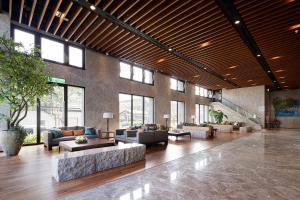 a large lobby with couches and tables and windows at Lakeshore Hotel Suao in Suao