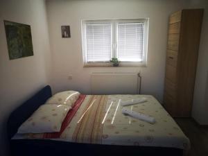 Postel nebo postele na pokoji v ubytování Apartman Borna