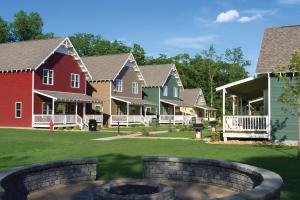 a row of houses with a fire pit in a yard at Arrowwood Resort Hotel and Conference Center - Alexandria in Alexandria