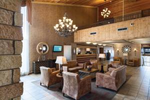 a lobby of a hotel with couches and chairs at Arrowwood Resort Hotel and Conference Center - Alexandria in Alexandria