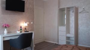 TV a/nebo společenská místnost v ubytování Müller Residenz Zur S-Bahn Karlsfeld