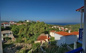 a village on a hill with houses on it at Fantasia House in Alonnisos