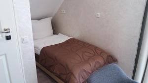Postel nebo postele na pokoji v ubytování Müller Residenz Zur S-Bahn Karlsfeld