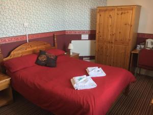 A bed or beds in a room at Chester Lodge 