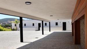 an empty hallway of a building with a view at Residence ACQUA LINDA Porticcio in Porticcio