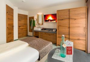 Posteľ alebo postele v izbe v ubytovaní Hotel-Garni Jakober