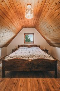 Un pat sau paturi într-o cameră la Szent György Cottage