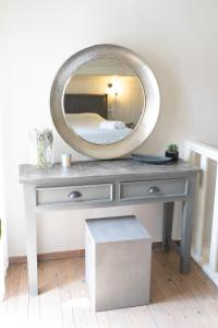 a dressing table with a mirror on top of it at Anna Maria's, cozy studio in the heart of Fiscardo in Fiskardho