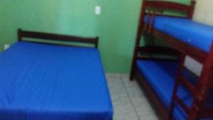 Ένα ή περισσότερα κρεβάτια σε δωμάτιο στο Chácara moquem 2 +12 φωτογραφίες