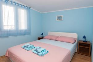 Postel nebo postele na pokoji v ubytování Apartments Vjera