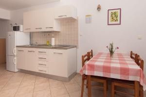 A kitchen or kitchenette at Apartments Vjera