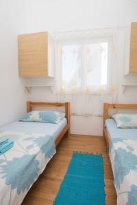 Postel nebo postele na pokoji v ubytování Apartments Vjera