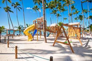 a playground on the beach with palm trees at Beach Apartment - Marbella, Juan Dolio!! Getaway Offer!! in Juan Dolio