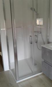 a shower with a glass door in a bathroom at Aux Portes du Beaujolais in Belleville-sur-Saône +15 photos