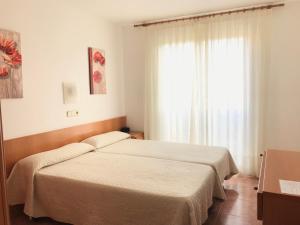 Postel nebo postele na pokoji v ubytování Hotel Mare Nostrum + 23 fotografií