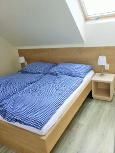 Postel nebo postele na pokoji v ubytování Rezidence Pálava