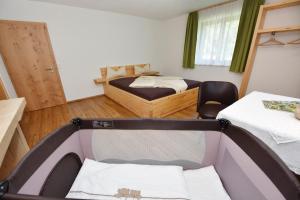A bed or beds in a room at Mottnerhof