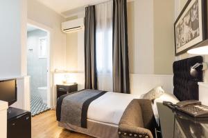 Кровать или кровати в номере BYPILLOW California