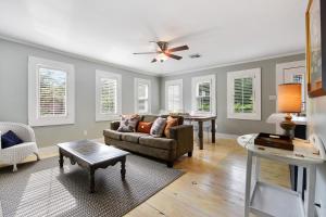 a living room with a couch and a table at T'Frere's Bed & Breakfast in Lafayette
