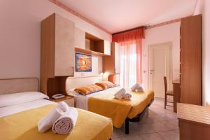 Postel nebo postele na pokoji v ubytování Hotel Atlantic