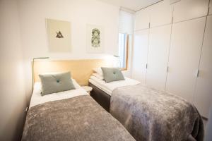 Кровать или кровати в номере Santa's Resort & Spa Hotel Sani Apartments