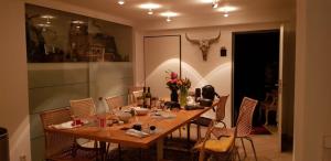 a dining room with a table and chairs at B8 - just a private accommodation in Düsseldorf