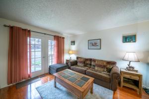 a living room with a couch and a table at Polar Bear Den in Anchorage