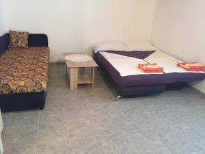Posteľ alebo postele v izbe v ubytovaní Apartmani Atila Damir